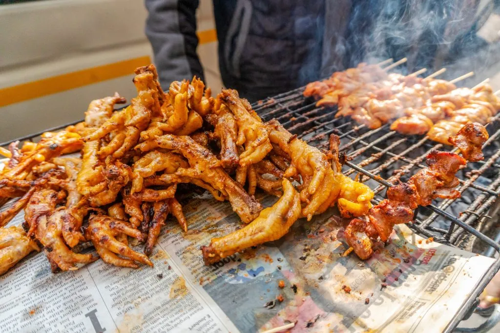 South African street food - barbecued chicken skewers and feet